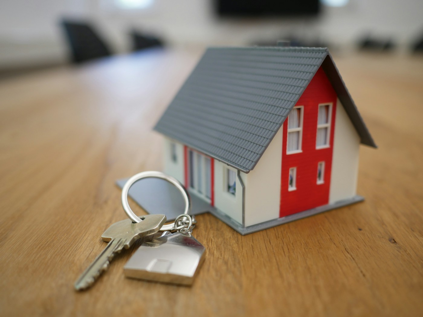 Property transaction documents and keys on a desk